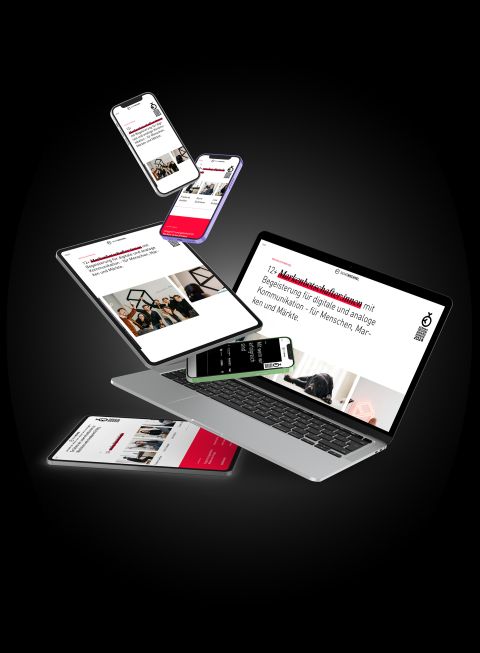 Digitale Darstellung einer responsiven Website auf Laptop, Tablets und Smartphones, auf schwarzem Hintergrund.