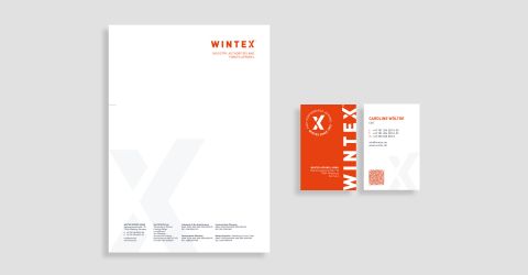 Wintex-Geschäftsausstattung mit Briefpapier und Visitenkarten in modernem Design mit orangefarbenem Logo.