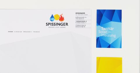 Briefpapier und Visitenkarte der Firma Spissinger mit Logo sowie Themen zu Sanitär, Solar und Heizung.